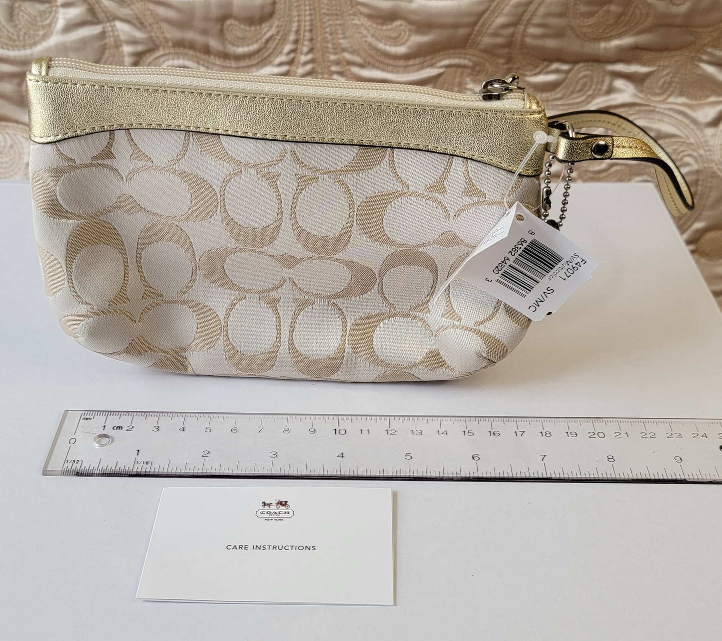 Coach: Beige Signature Zip Wristlet NEW WITH TAGS